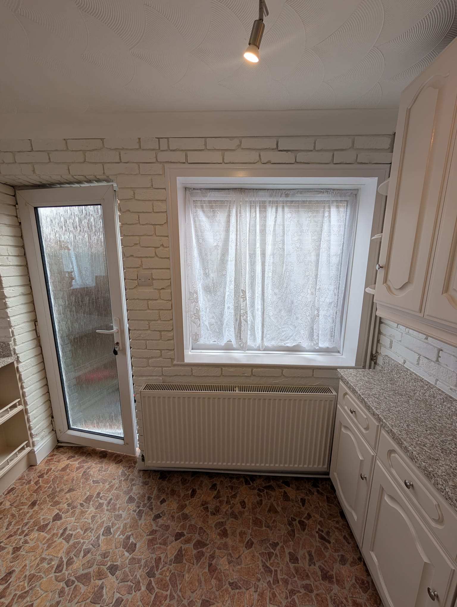 Cream kitchen white brick walls Norwich